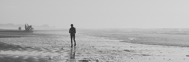 Mac walking on the beach cooling down after a run.